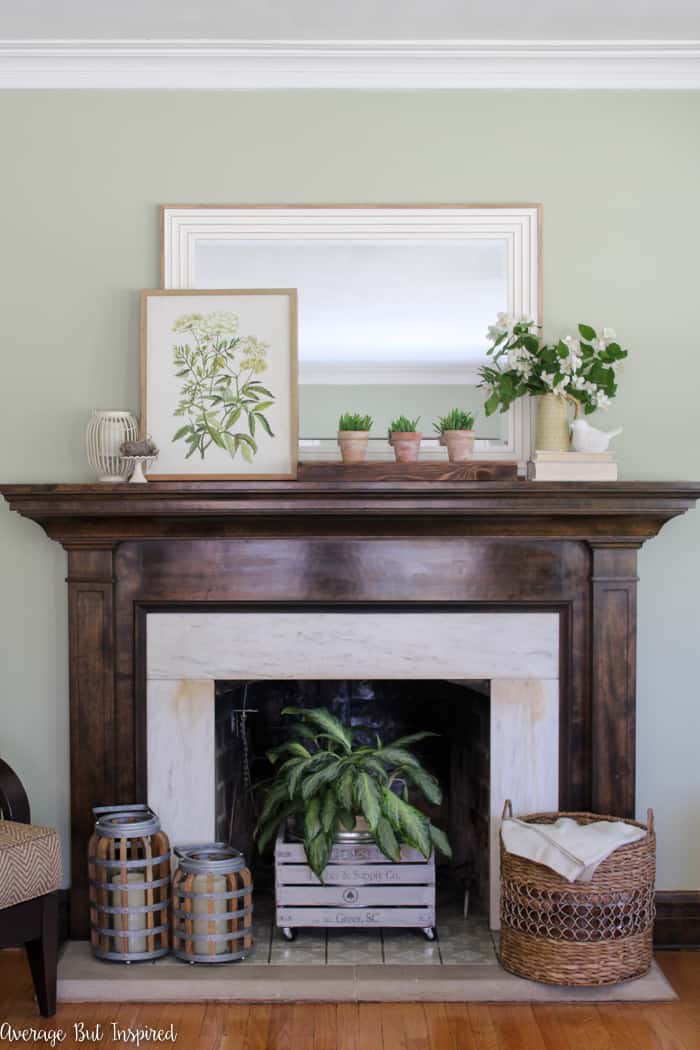 Update your living room with a simple summer mantel and decor updates. See how this blogger freshened her home for summer with inexpensive items and fresh greenery.