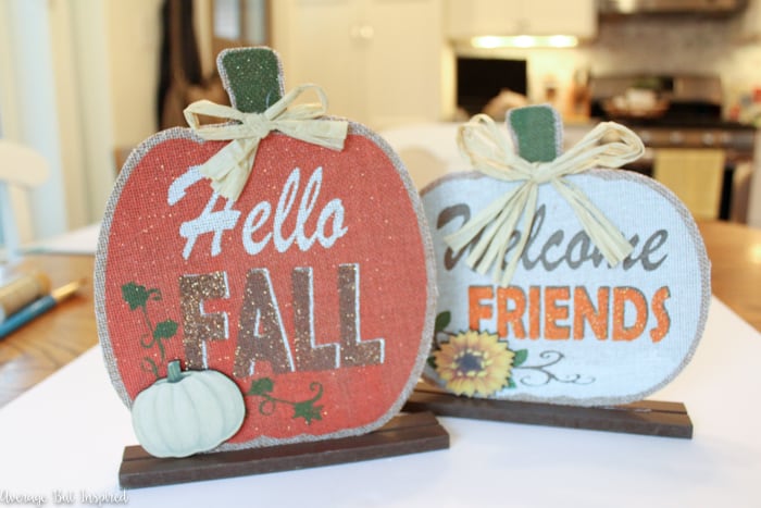 So cute! Transform Dollar Tree pumpkin decorations into adorable pumpkin picture frames that are perfect for displaying fall photos! #dollartree #dollartreecrafts #dollartreedecor #fallcrafts