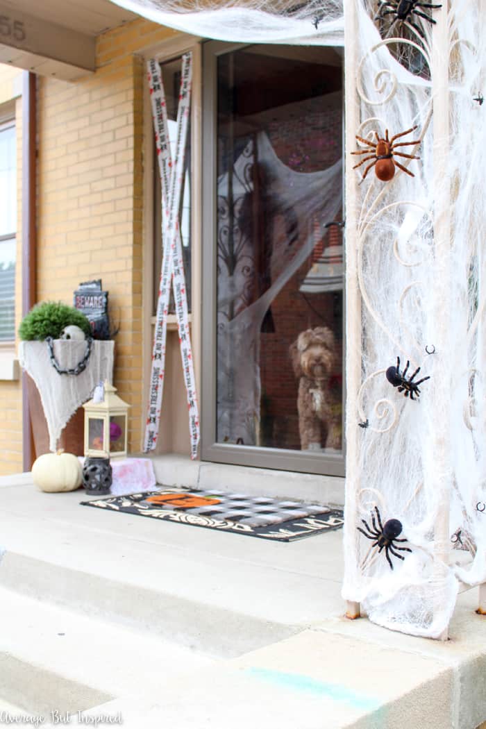 This Halloween porch is filled with dollar store items! Check out the post to see how to use dollar store Halloween decorations to deck out your home for Halloween.