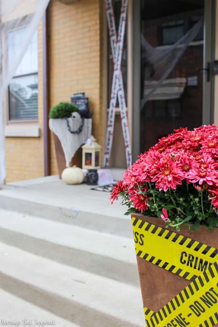 This Halloween front porch is filled with dollar store Halloween decorations. See how to decorate your Halloween porch on a budget!