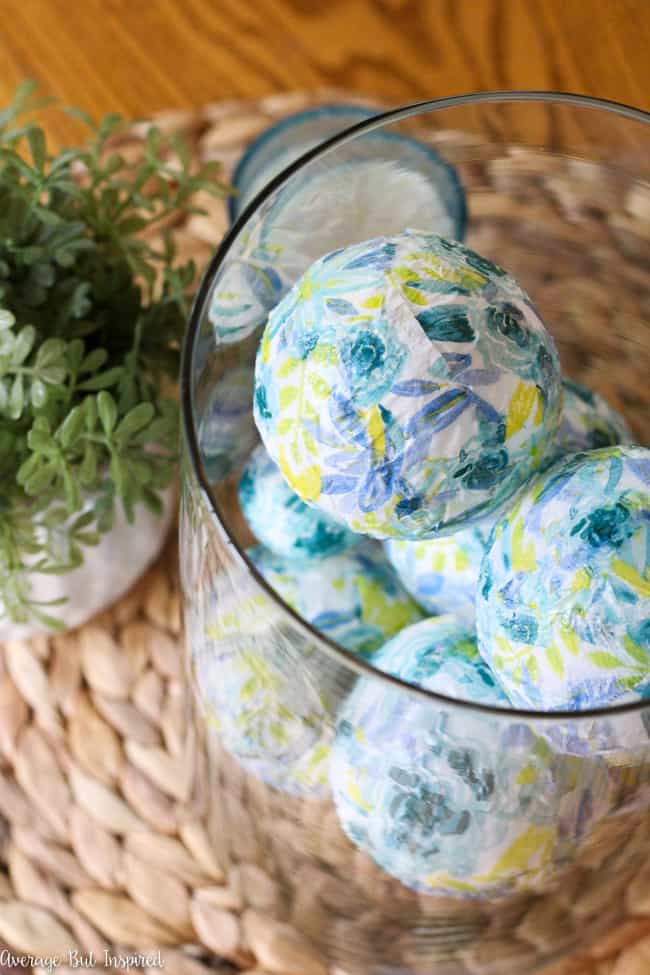 Use items from the dollar store to create beautiful DIY decorative ball vase fillers! This easy dollar store craft uses surprising items for a pretty project!
