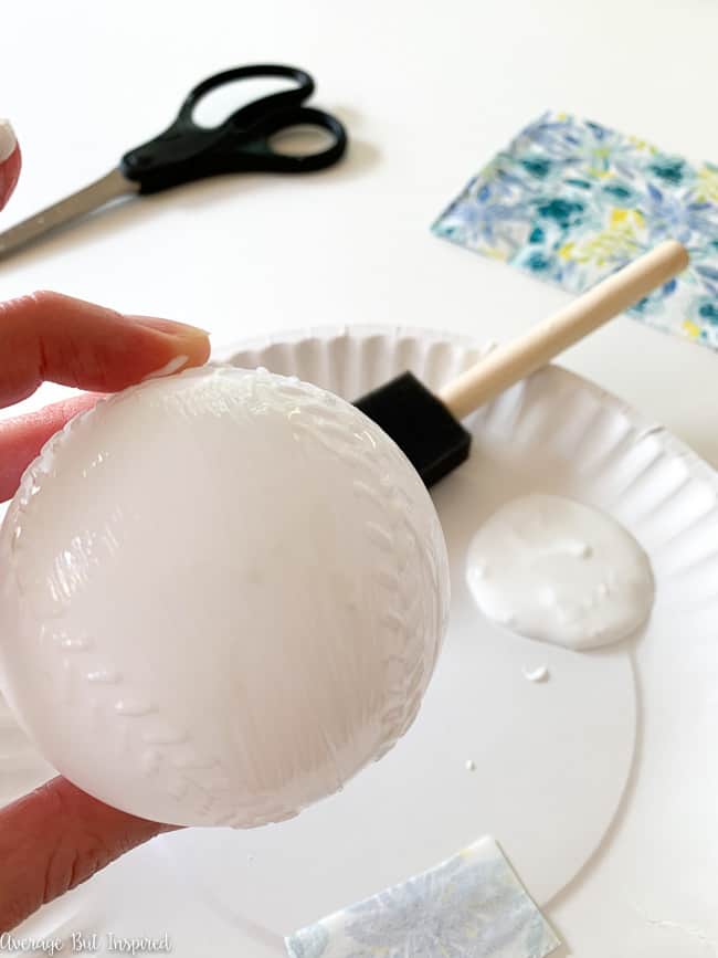 Apply Mod Podge to a plastic baseball to create decorative ball vase fillers!