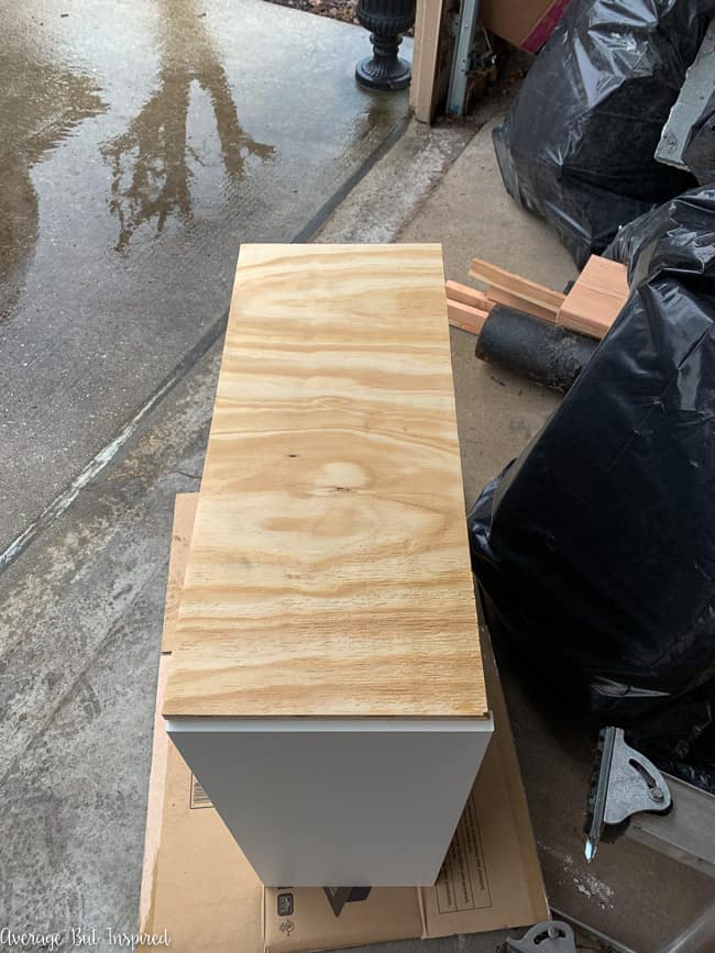 Adding a plywood base and plywood back to the IKEA Silveran sink cabinet is the beginning of a useful IKEA bathroom vanity hack.