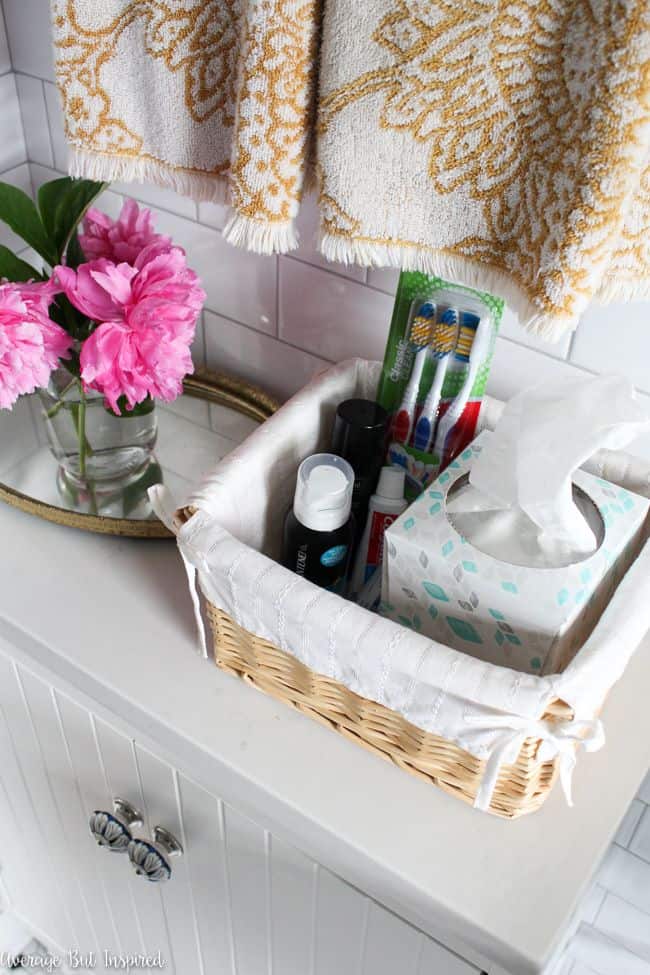 Having a basket of items that guests may have forgotten to bring is a nice touch for a guest bathroom. Read this post for more great ideas on getting your bathroom ready for guests!