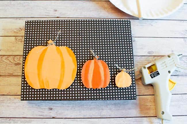 Create a cute pumpkin sign for fall.
