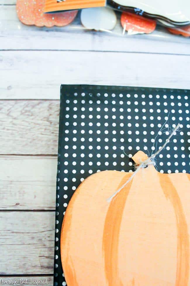 Create a unique pumpkin sign for fall.
