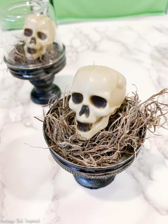 Use Dollar Tree mini skulls to make adorable Halloween cloches for your decor this Halloween.