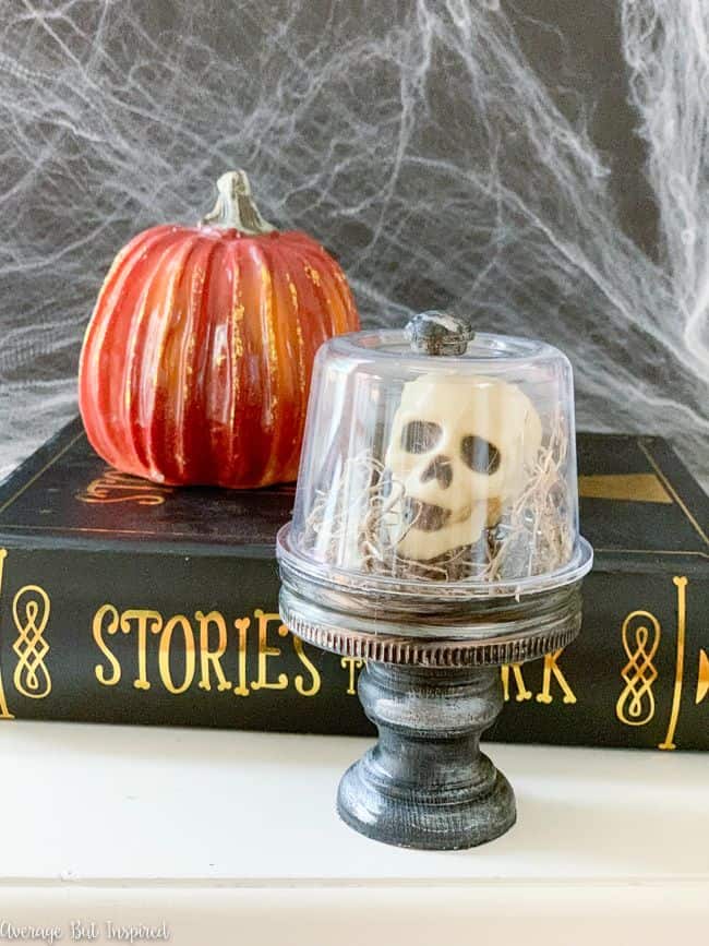 Make a Halloween cloche with skulls to add some creepy and cute to your Halloween decor this year.