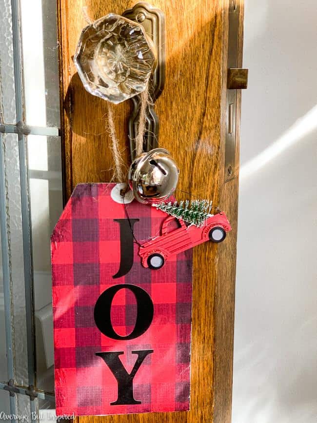 Add a dash of charm to your Christmas decor with these dollar store DIY decor tags! The buffalo check wrapping paper makes these tags on trend for Christmas this year! Using only dollar store supplies, you can make these large tags to add to wreaths, vases, to use as ornaments, to put in tiered trays, or to hang from a doorknob! The possibilities are endless, and these are such a cute Christmas craft!