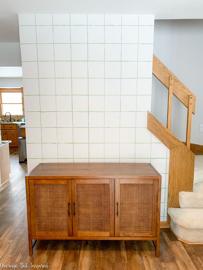 The Warwick 3-door cabinet from Target is a beautiful console table when paired with this hand-painted DIY accent wall.