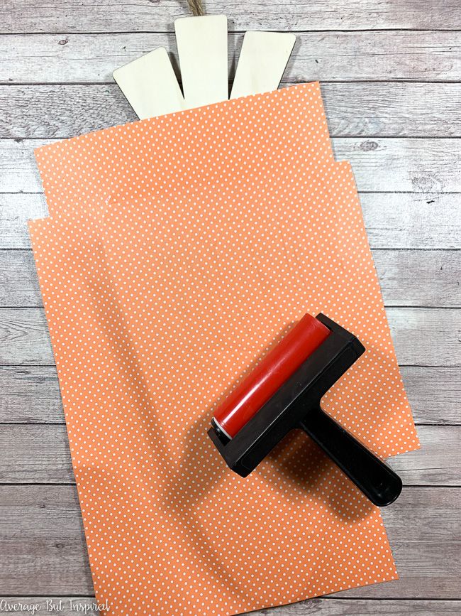 Use polka dotted orange scrapbook paper to create an adorable carrot door hanger.
