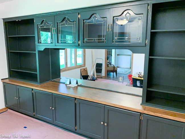 BEFORE: this plate glass mirror was a plain part of this built-in china cabinet. This blogger created a technique to antique the mirror from the front, and it resulted in a gorgeous finish.