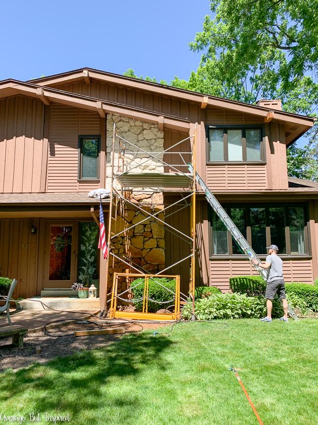 BEFORE - this 1970s brown house was really dated. See the AFTER exterior updates. It looks like a new house!