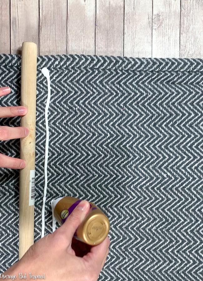 Use a Dollar Tree rug and toilet plunger to create tapestry art.