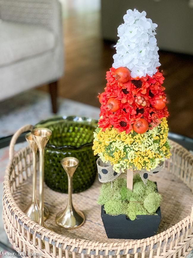 This floral candy corn topiary is the cutest DIY fall decoration! It's so unique and adorable, and easy to make! Get written instructions and a video tutorial in this blog post.