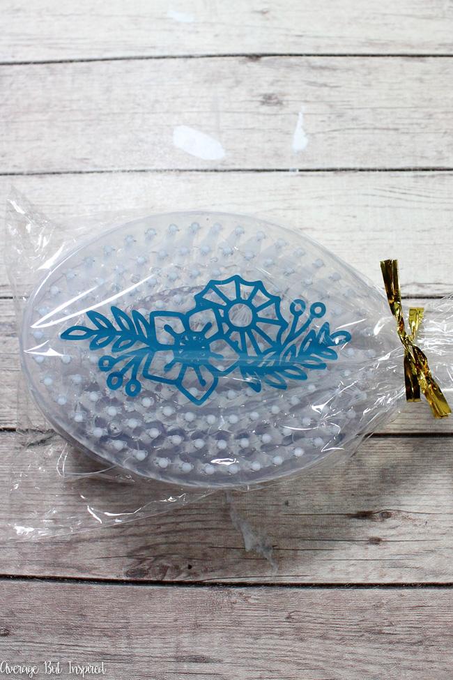 Customize a dollar store bath brush with a vinyl embellishment.