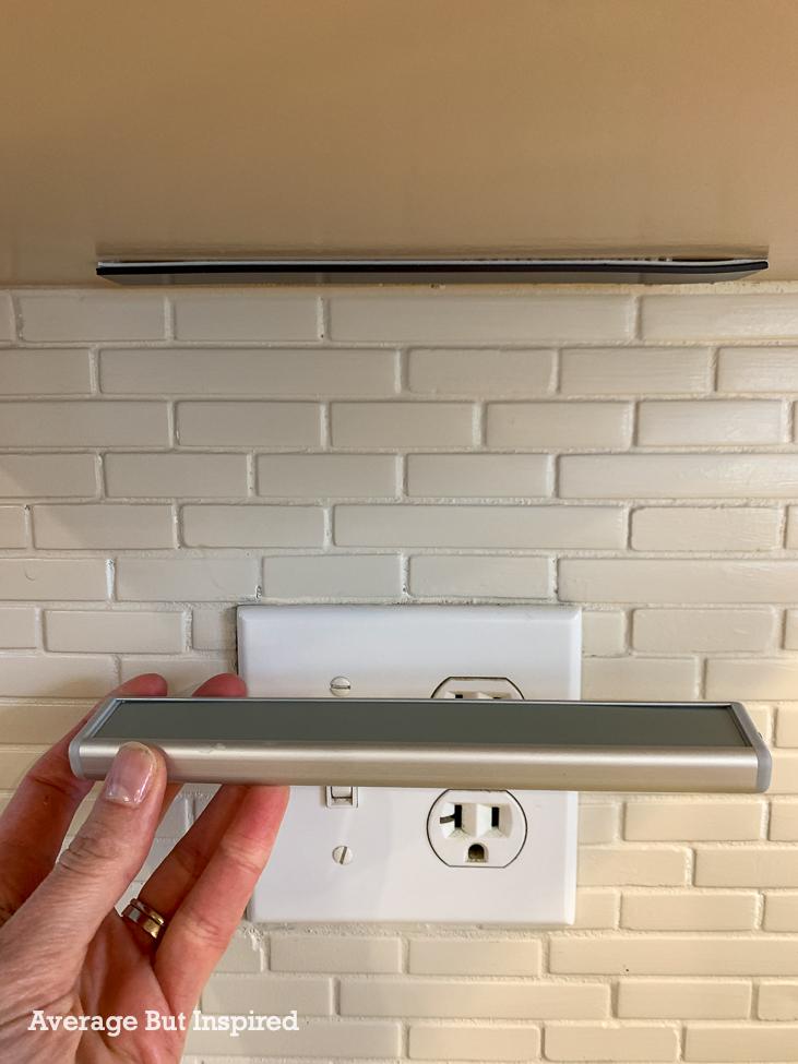 These under cabinet lights attach to the cabinet with self-adhesive magnetic strips. This makes them very easy to remove for charging.