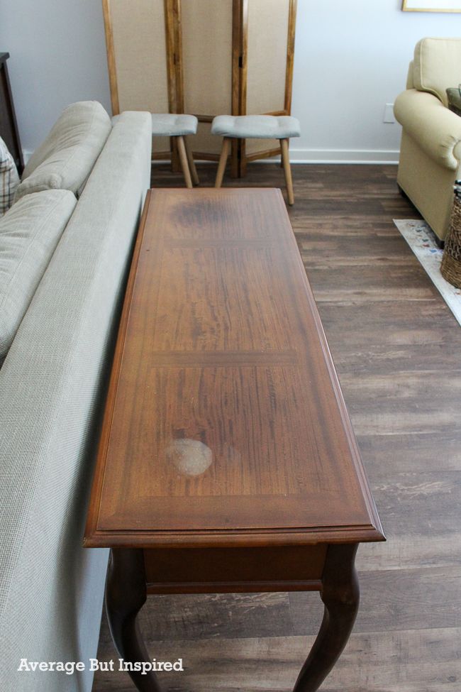 This cherry sofa table had a lot of fading from the sun and staining damage on top. The owner painted it and made it beautiful again.