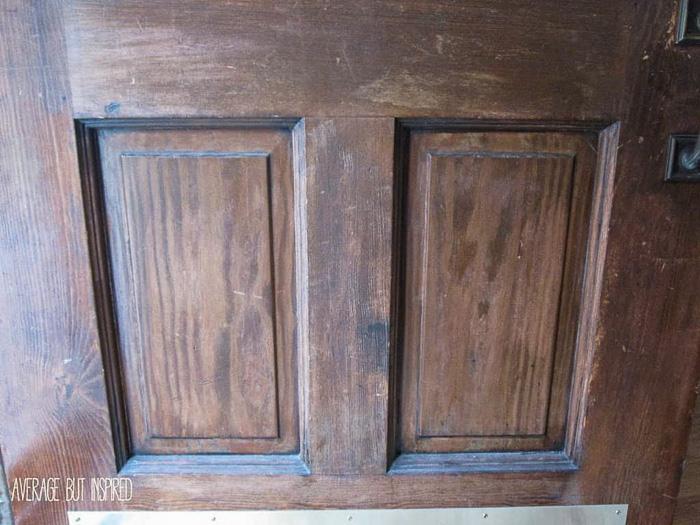 This wood front door was in terrible shape before she restained it with gel stain and gave it a brand new look.