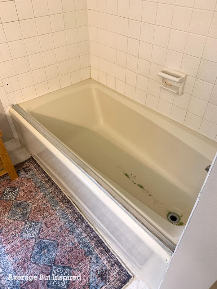 Before painting this tub with the Rustoleum Tub and Tile Kit, this almond bath tub had been reglazed. It was previously avocado green.