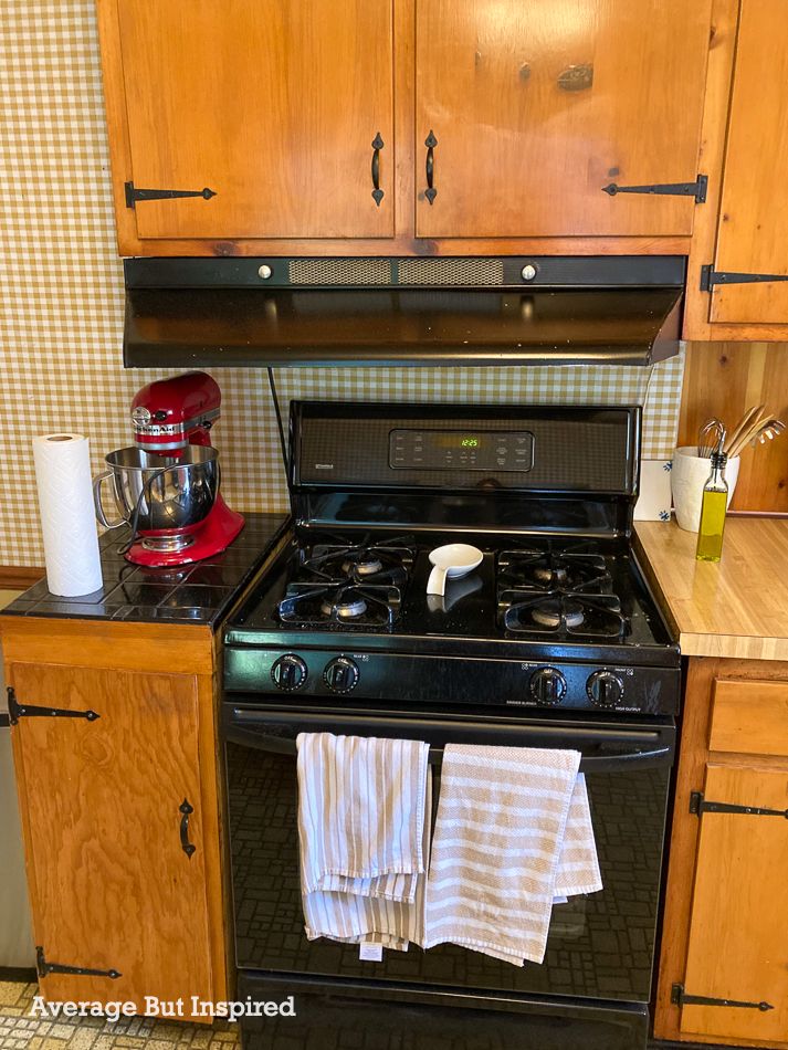 BEFORE: This 1950s kitchen had a range vent hood that was so low, you could not even use the back burners of the stove.