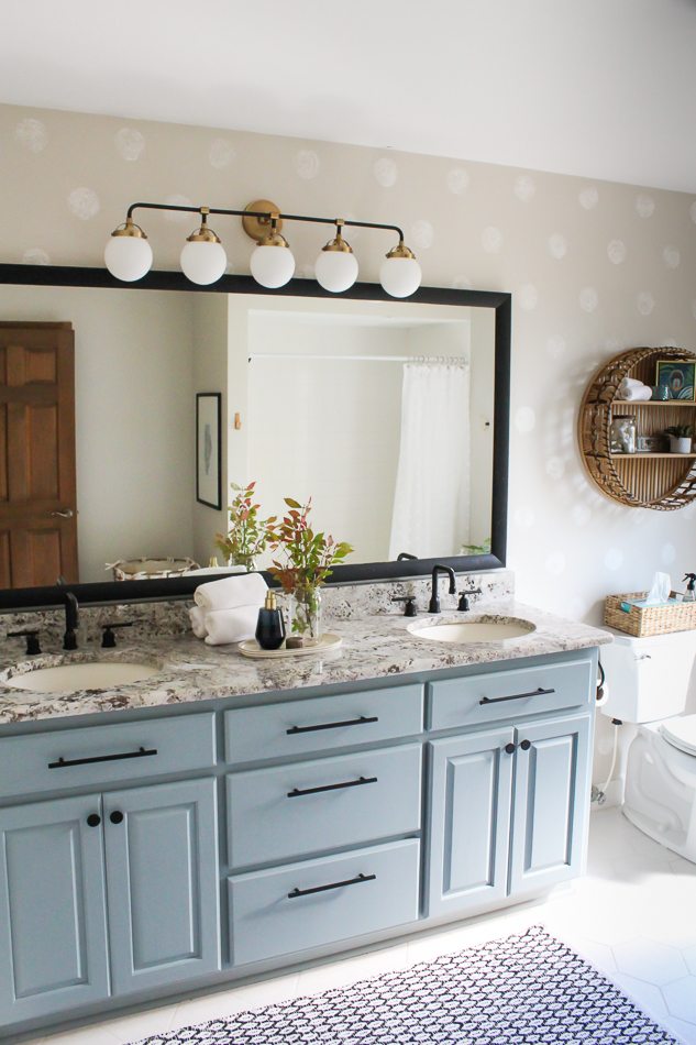 This bathroom vanity is painted Irish Garden by Heirloom Traditions Paint. It's a blue green paint that looks great in this bathroom!