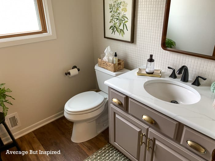 Painted granite countertops look fresh and clean in this bathroom. Find out how durable painted countertops are in this post.