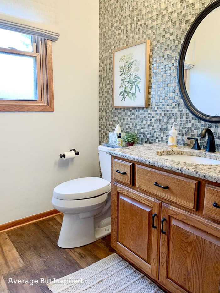 BEFORE she painted her granite countertop, the bathroom had clashing tile and countertops.