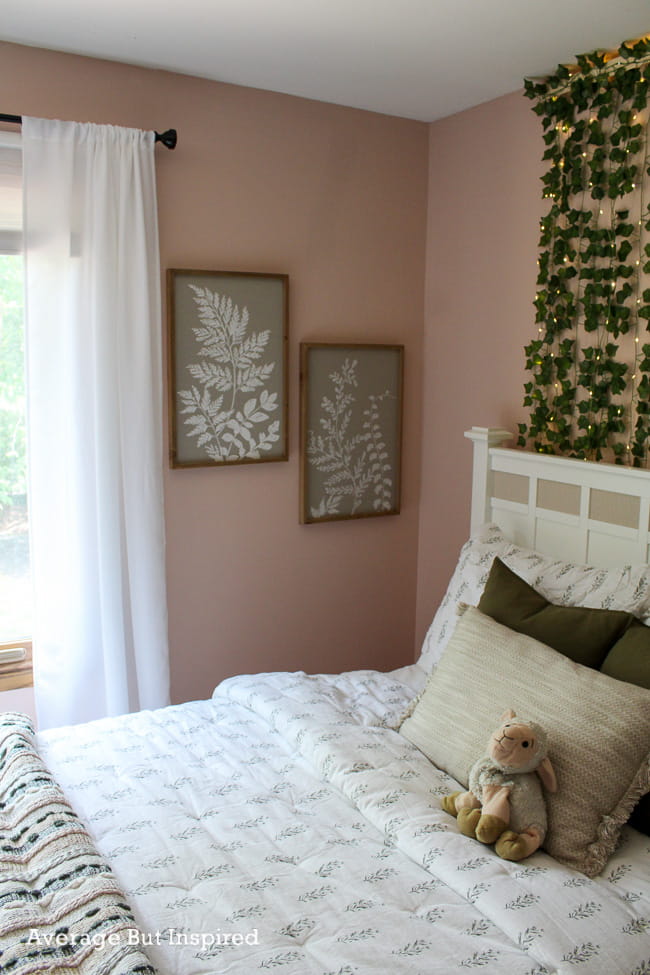 This boho bedroom is painted Benjamin Moore Odessa Pink.
