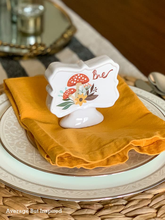 Use dollar store window clings to make adorable place cards for any occasion! These place cards are reusable, and the look can be changed easily.