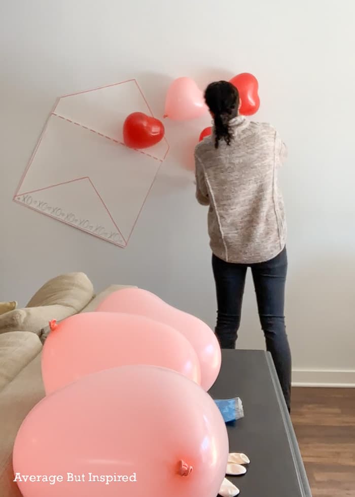 Attach heart-shaped balloons to a wall to create a fun Valentine photo wall! Use it in a photo booth or at a Valentine's Day party!