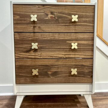 A plain IKEA Rast dresser got a MCM or mid-century modern makeover and was repurposed as a nightstand or bedside table.