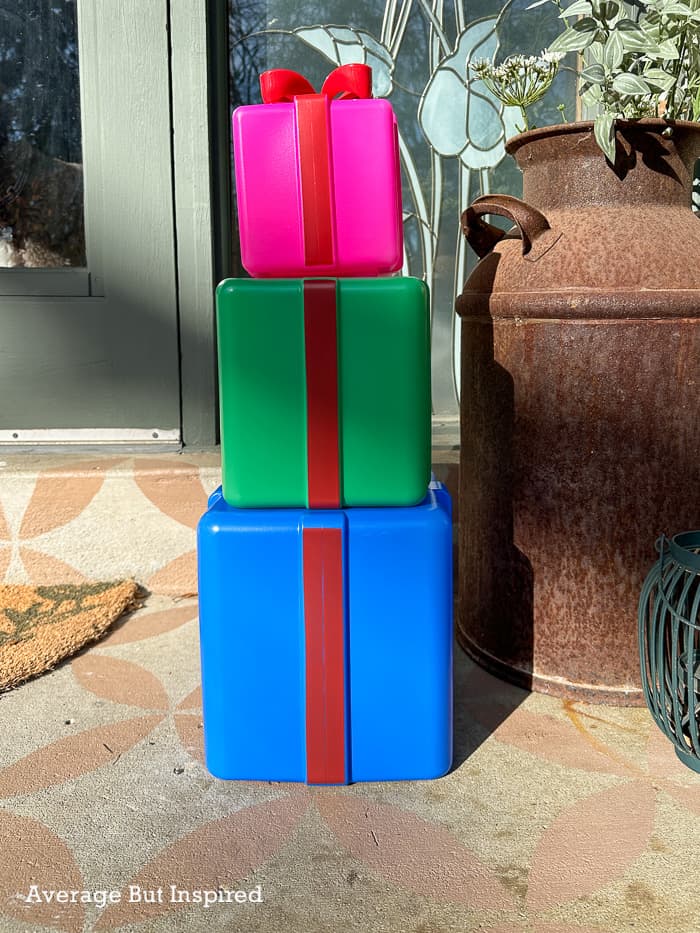 These Dollar Tree stacked presents are begging for a makeover! See how they turn into gorgeous Christmas decorations.