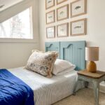Old cabinet doors were repurposed into an adorable headboard.