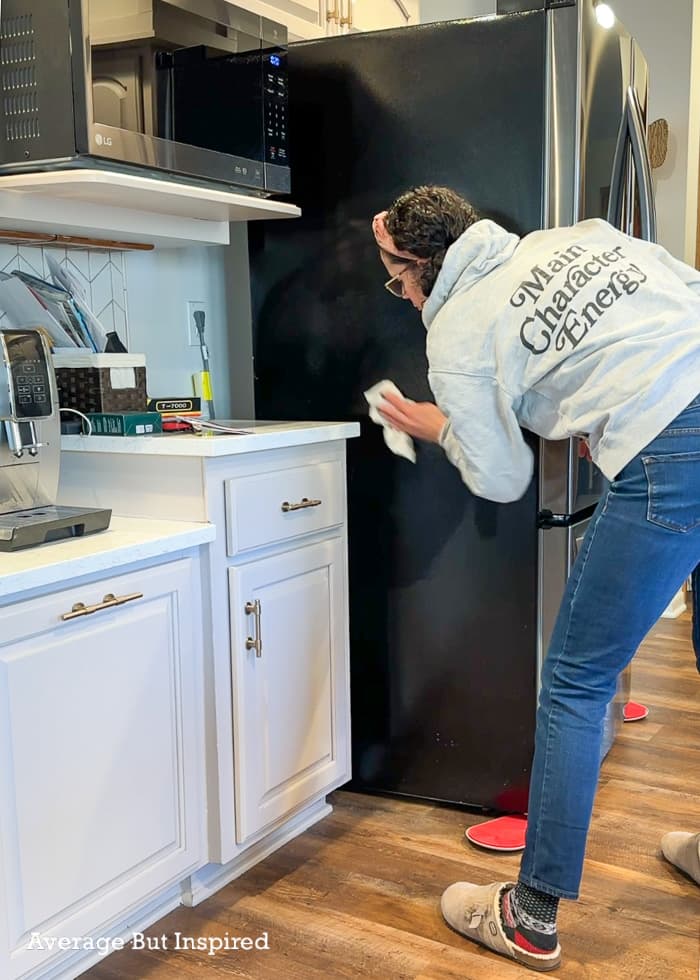 Before painting the side of a refrigerator, clean it well with prepaint cleaner like TSP or Krud Kutter.