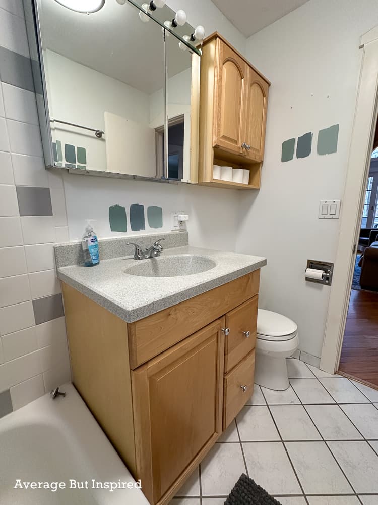 This dated bathroom in a cozy lake cottage needed a makeover with vintage charm.
