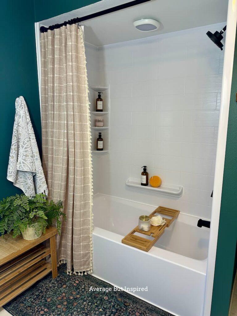 A battery-powered shower light adds light to a dark shower and tub.