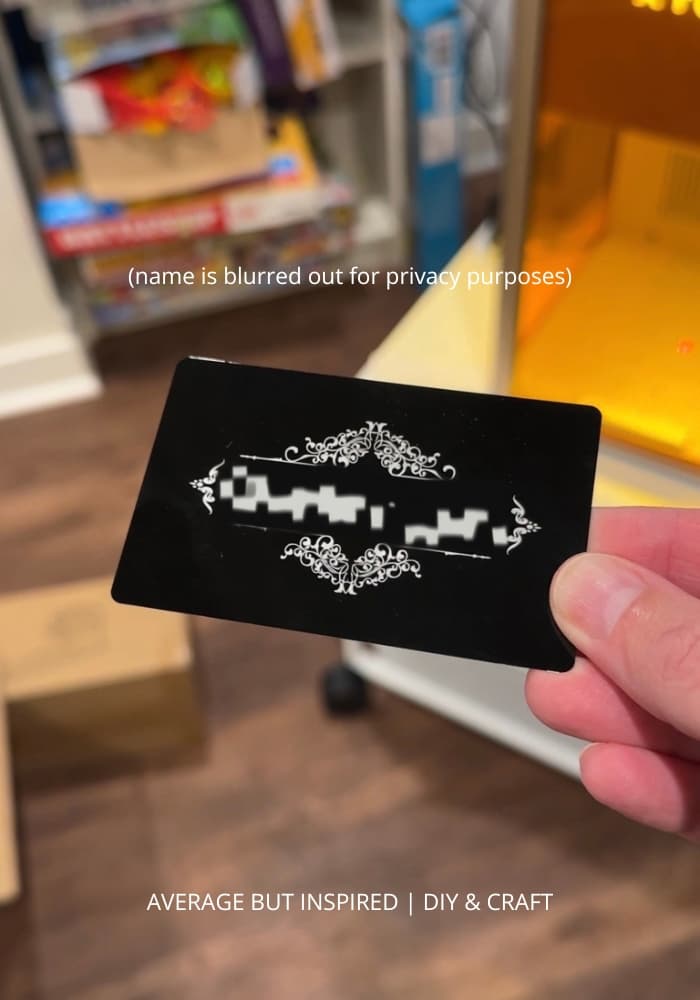 A metal business card engraved on the xTool F2 Ultra UV laser. This is the test project every F2 Ultra UV owner creates first.